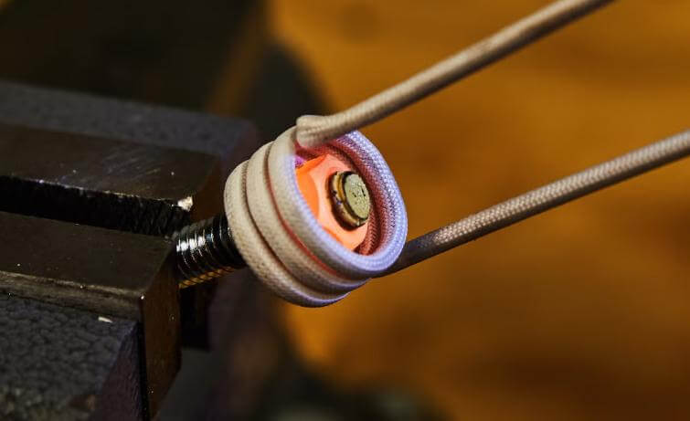What are the main components of the induction heater?